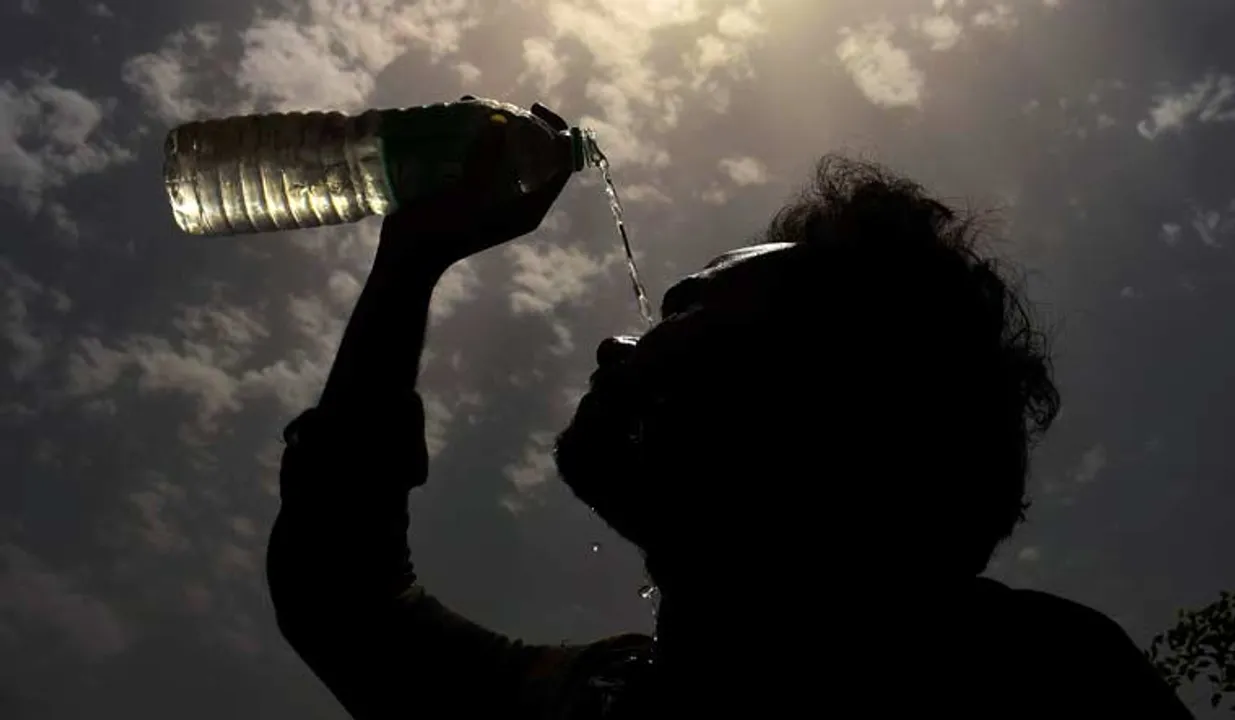  A man splashes water on his face on a hot summer day amid heatwave, in Gurugram | PTI 