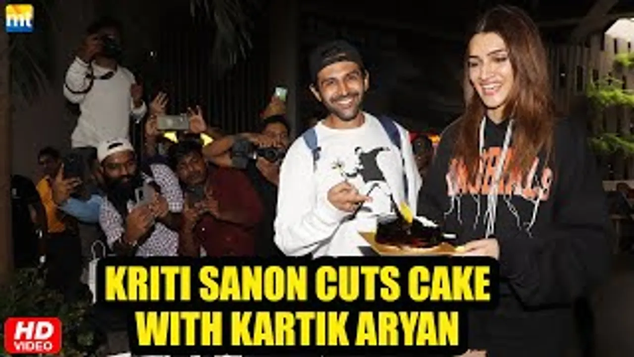 Kriti Sanon Cuts Birthday Cake with media at airport as she returns with Shehzada Kartik Aaryan