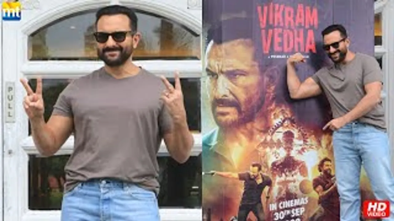 Vikram aka Saif Ali Khan shows his Biceps as he poses with Vikram Vedha Posters
