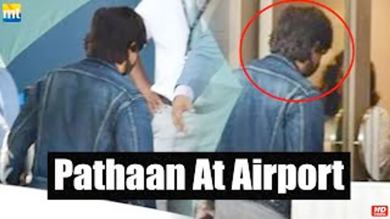 Shah Rukh Khan hides his PATHAAN look behind an umbrella, heads to Sharjah