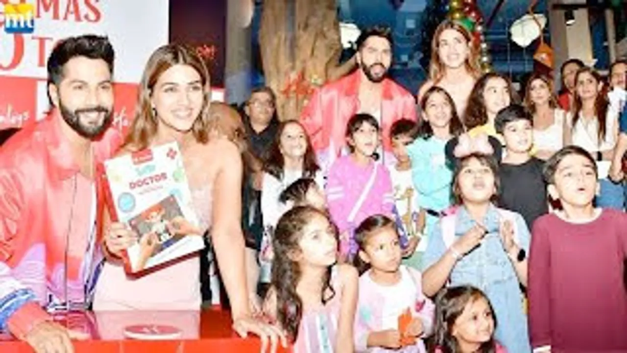 Varun Dhawan and Kriti Sanon bring early Christmas presents for the kids
