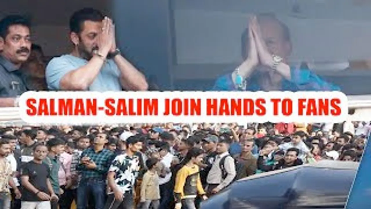 Salman Khan and his father Salim Khan join hands to the crowd gathered for his birthday