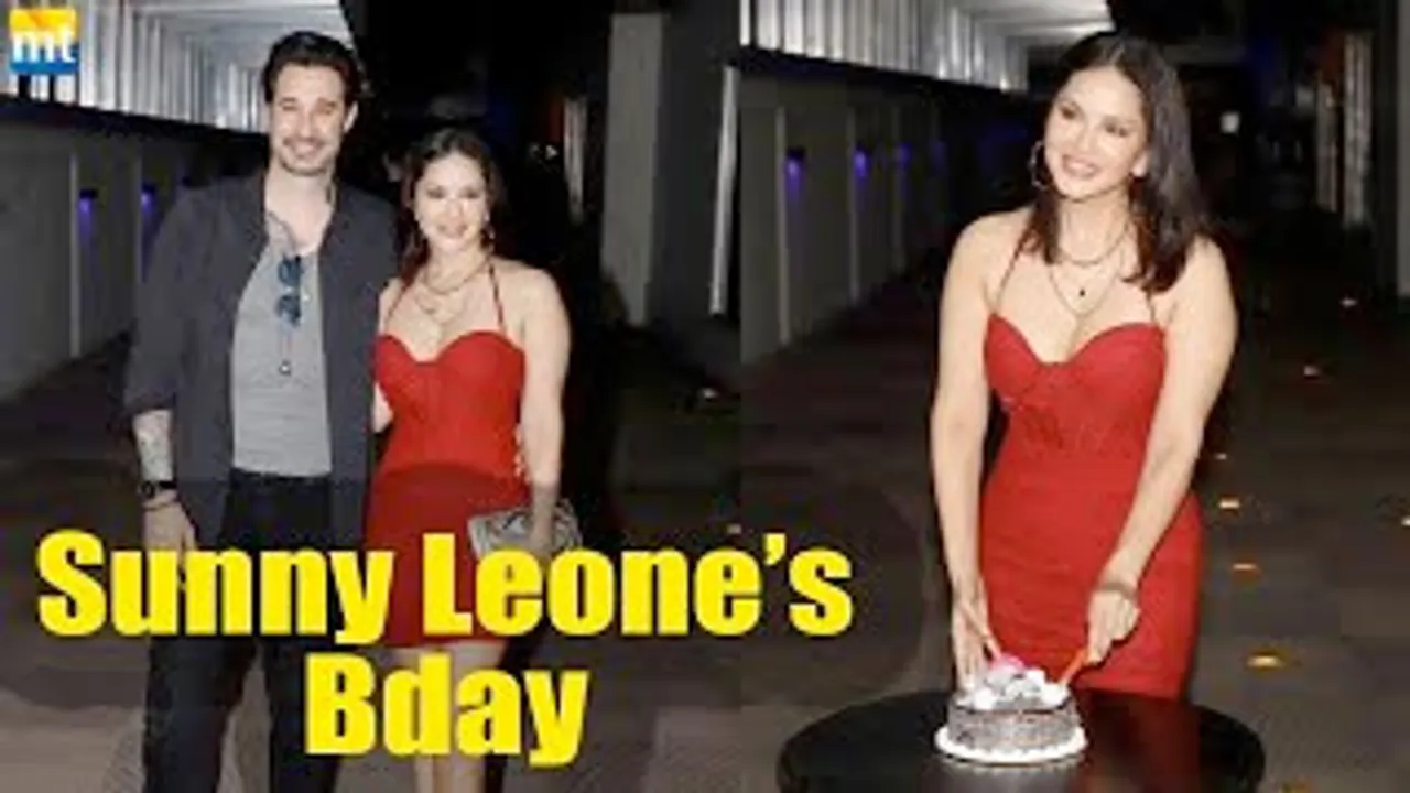 Sunny Leone cuts cake with the paps celebrating her birthday, husband Daniel Weber joins her