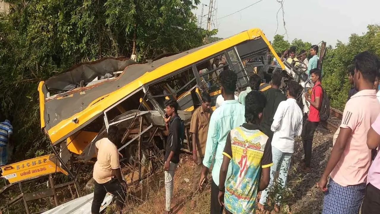  Train hits school van; death toll rises Photograph: (cuddalore) 