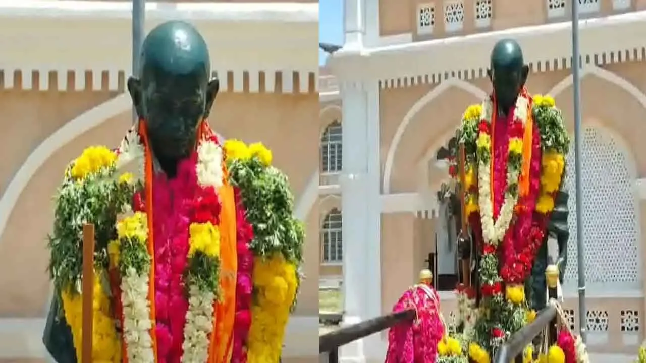  BJP executive decorate Gandhi statue with saffron stir in Madurai 