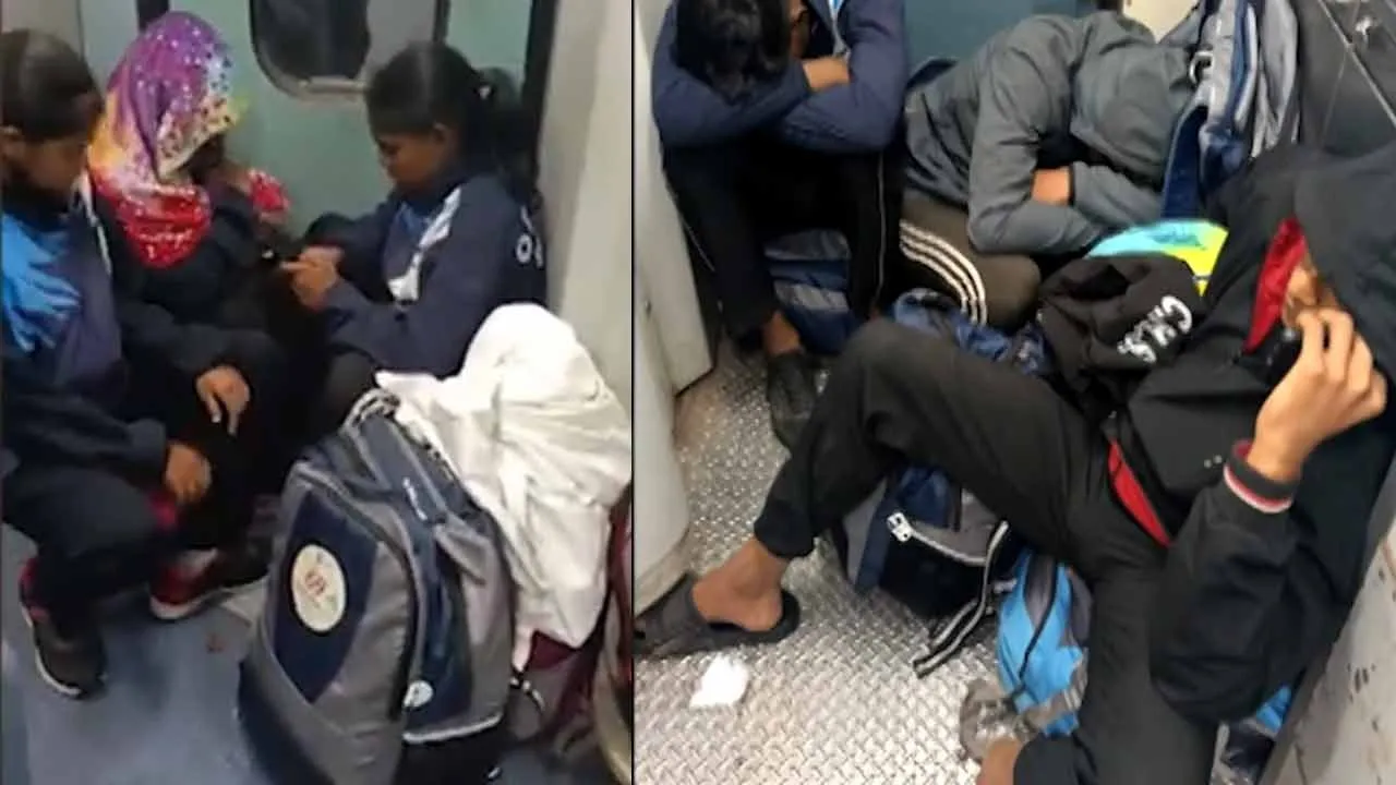  Athletes traveling near train toilets while on their way to the championship competition 