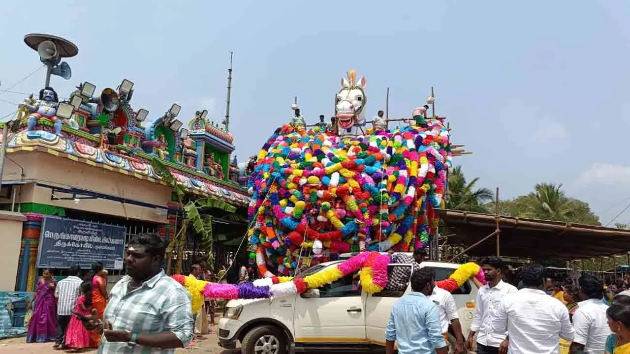  Horse statue decorated with local garlands and paper flower garlands in pudukkottai 