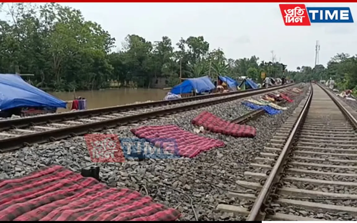 Assam: Flood-Hit People take shelter along Railway Tracks in Kampur