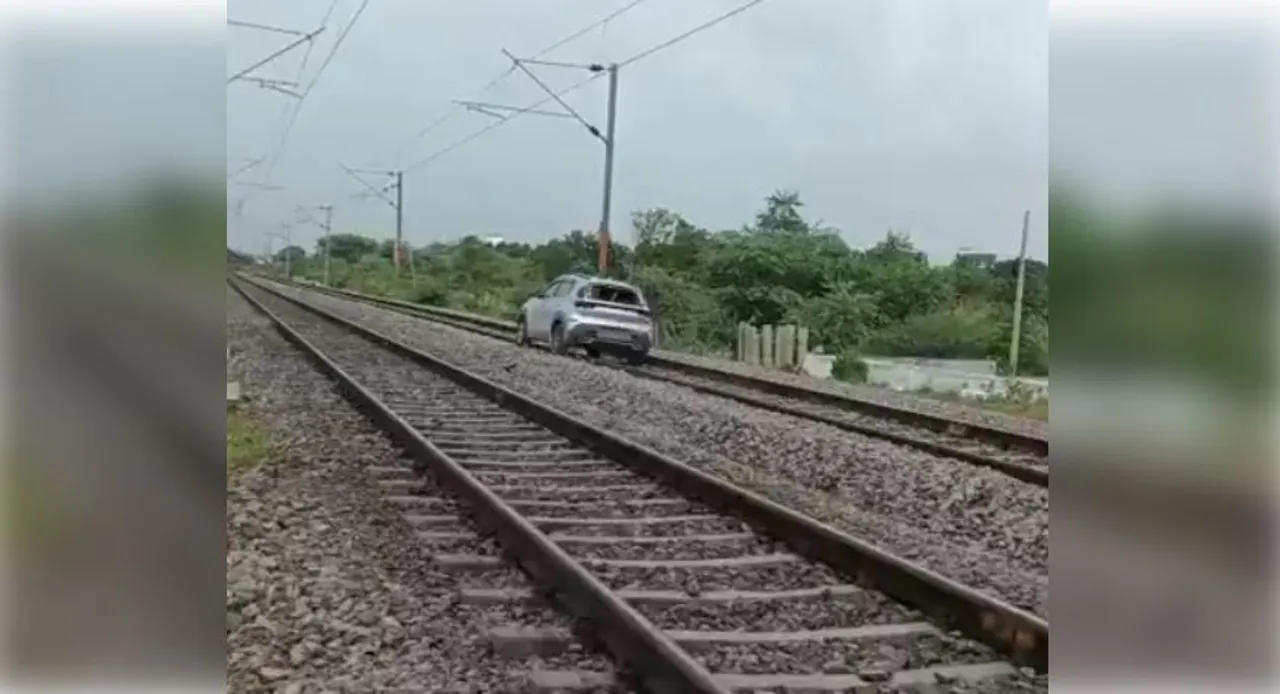  Woman drives car onto railway track in Telangana