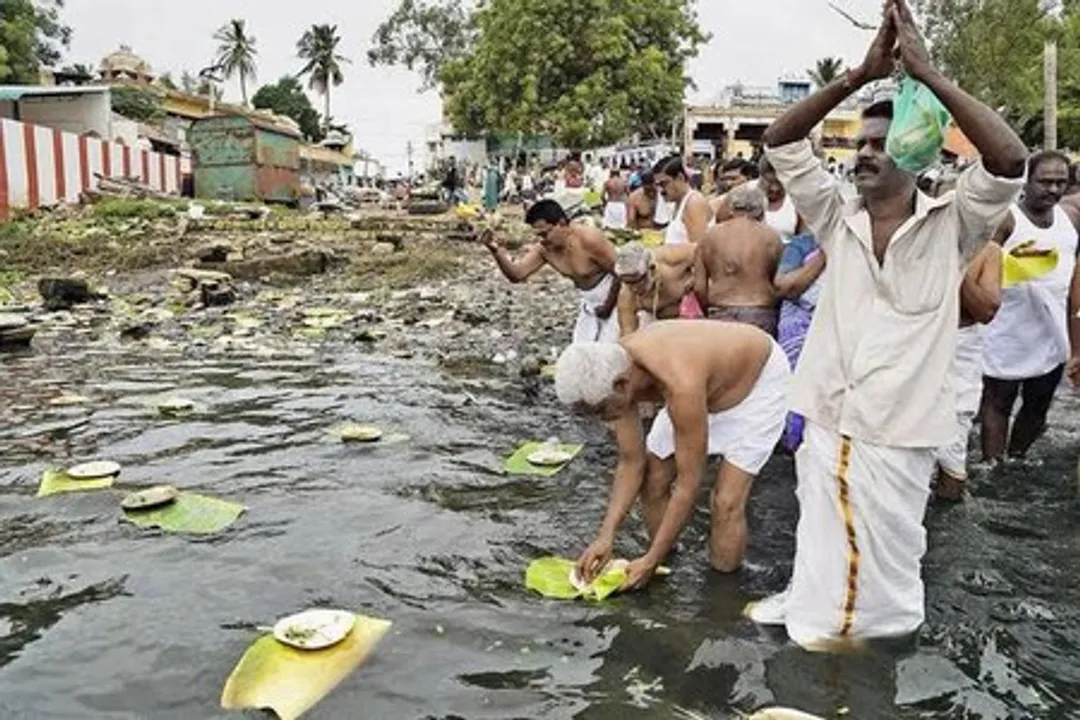  Devotees flock to Cauvery river for 'Aadi Amavasya' rituals