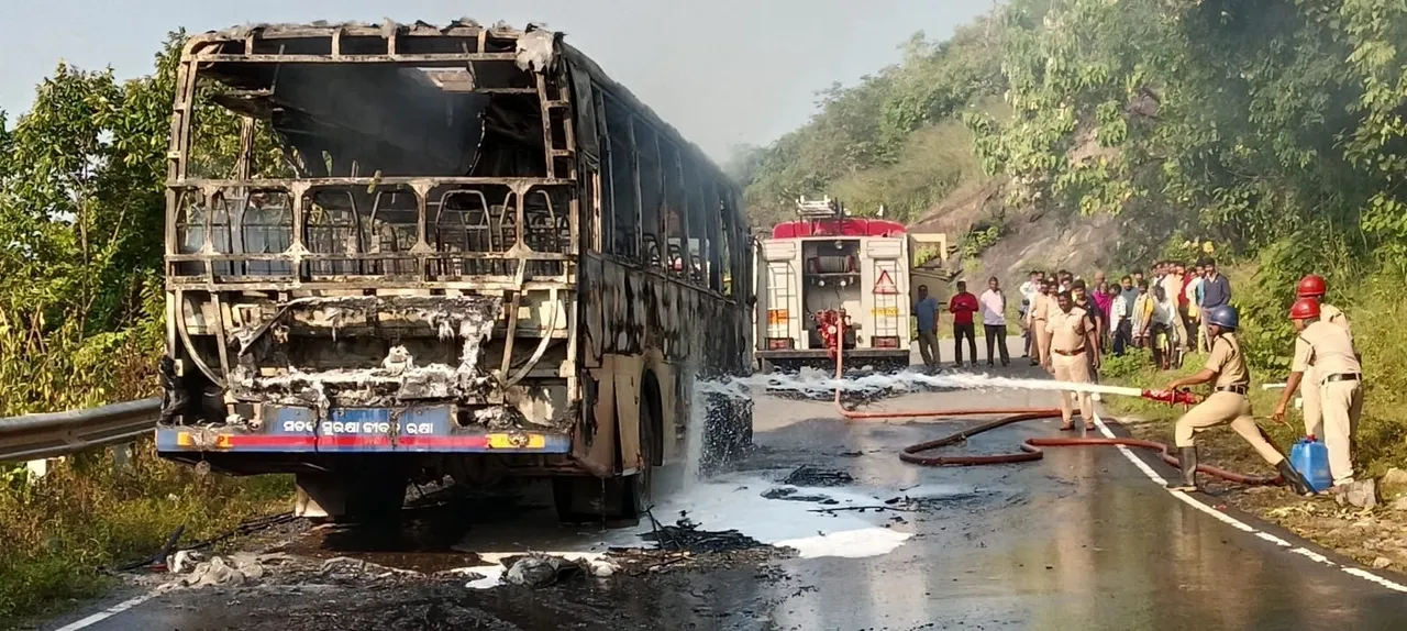  Fire services personnel dousing flames that caught the bus (Photo: Sambad) 