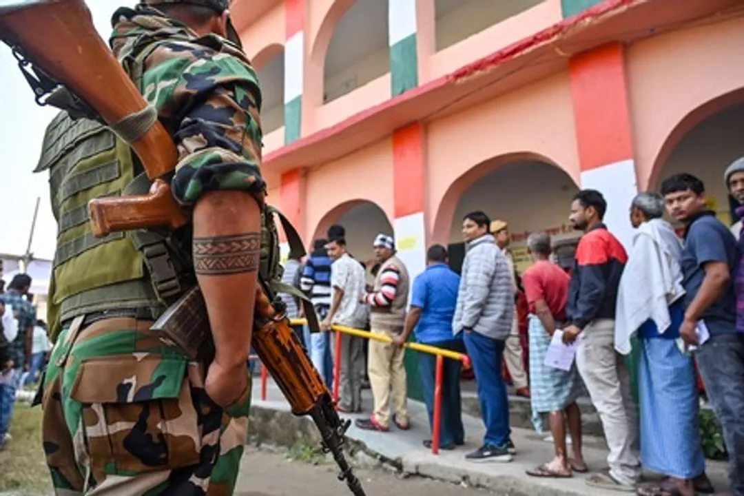  Security personnel outside a polling booth in Nuapada 