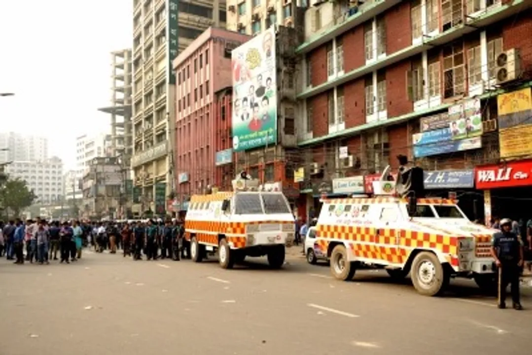  Security personnel patrolling a street in Bangladesh 