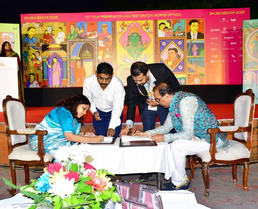  Commissioner-cum-Secretary Guha Poonam Tapas Kumar signs MoU with Director of the Film Heritage Foundation Shivendra Singh Dungarpur in Bhubaneswar 