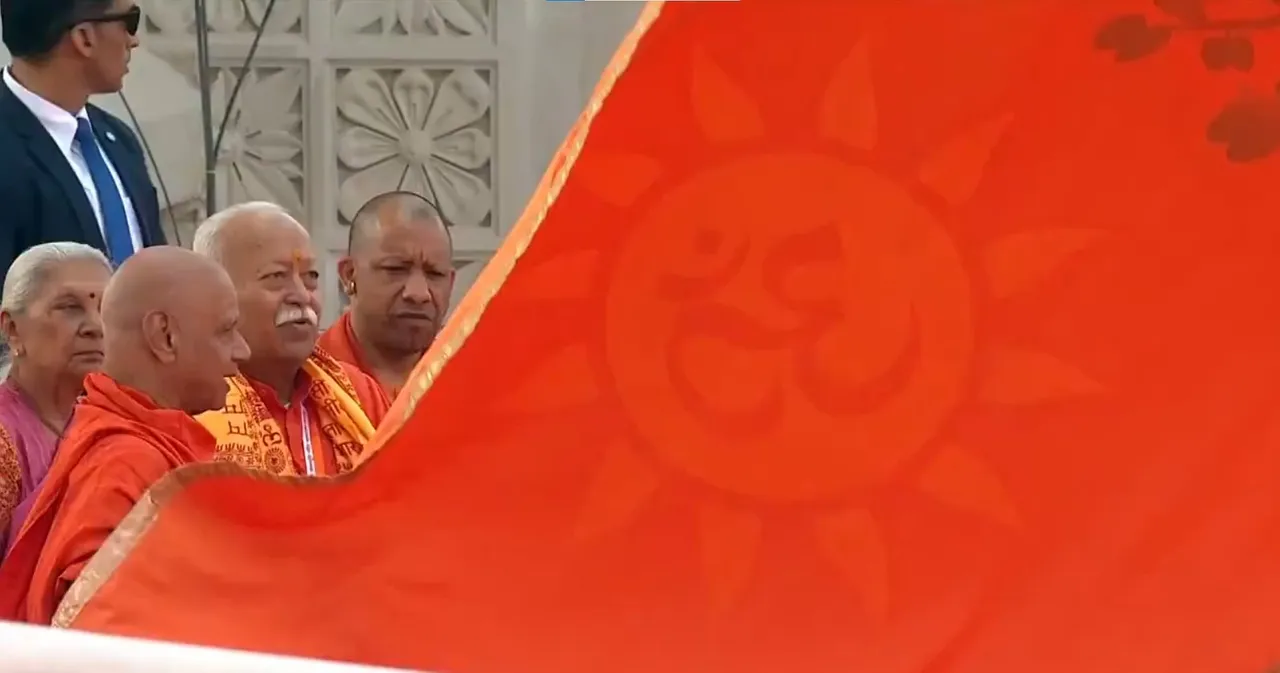  RSS Chief Mohan Bhagwat along with PM Narendra Modi and Uttar Pradesh CM Yogi Adityanath at Ram Temple flag hoisting ceremony in Ayodhya Photograph: (Screen grab from DD News/X) 
