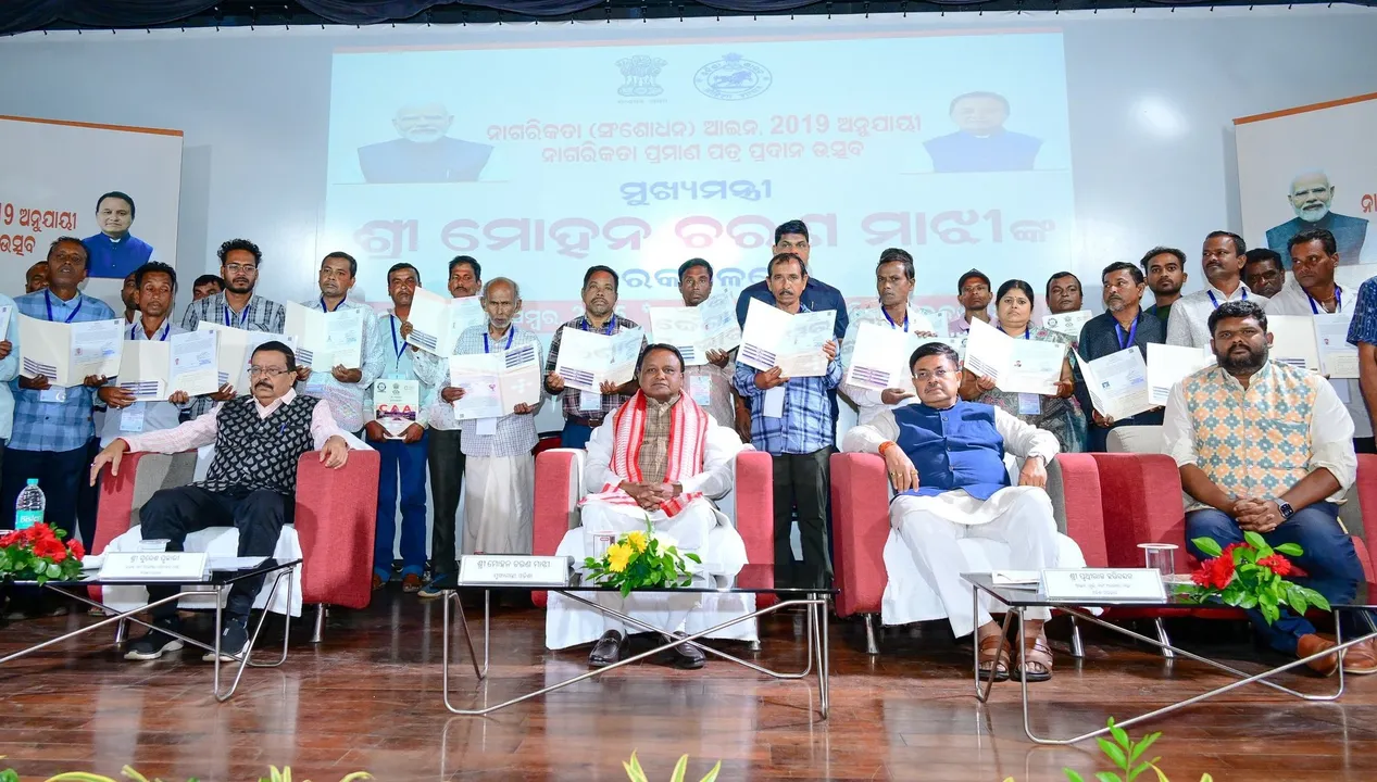  CM Mohan Charan Majhi and other dignitaries after providing citizenship certificates to the 35 individuals in Odisha.   