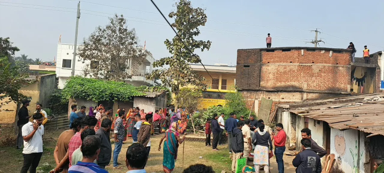  Locals outside house at Khalari village after Angul police reach to investigate into murder case Photograph: (Sambad) 