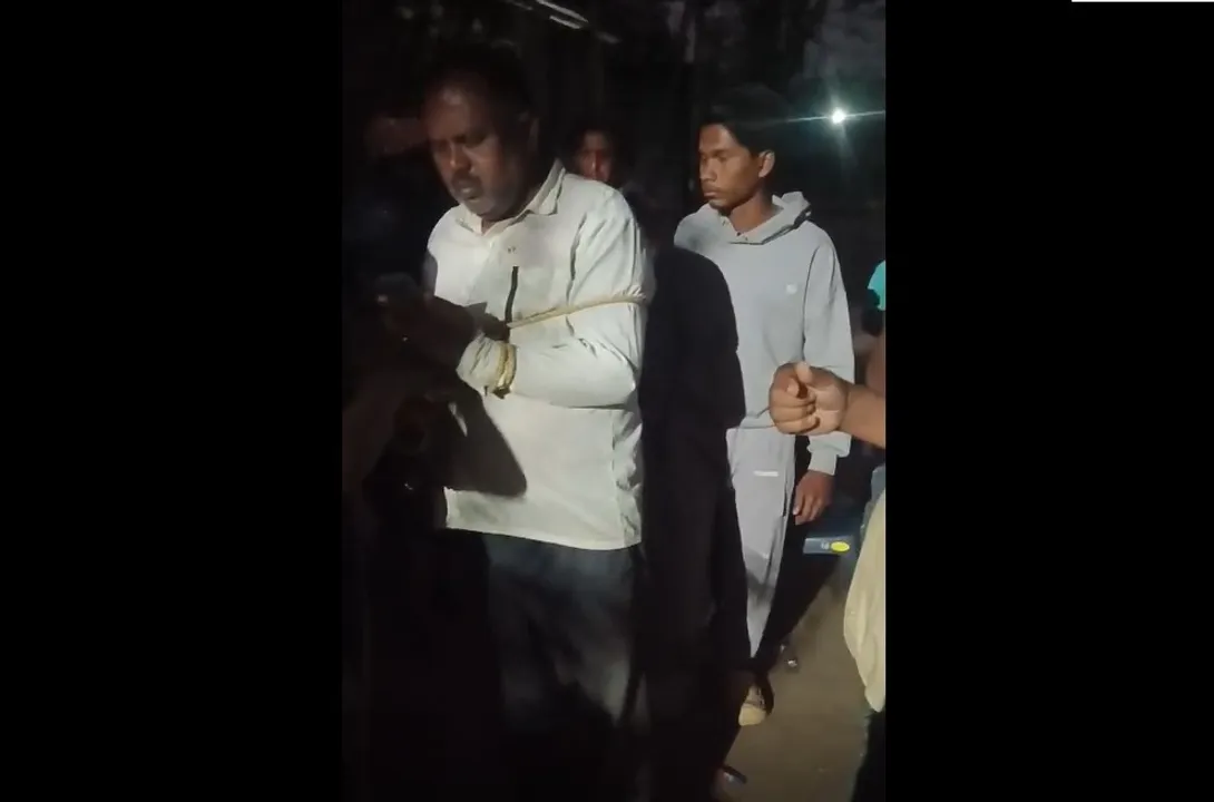  A paddy trader being paraded with his hands tied in Odisha’s Mayurbhanj district Photograph: (Sambad) 
