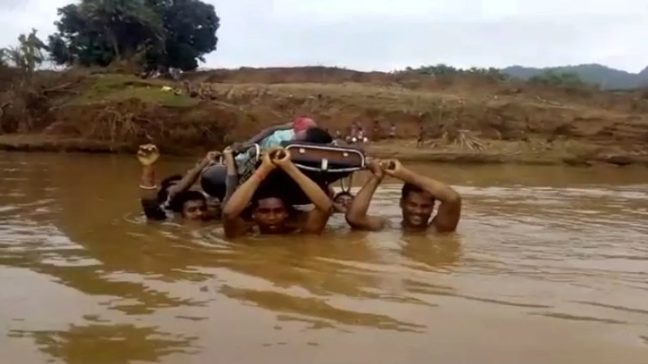  Pregnant woman ferried across river amid neck-deep water in Odisha