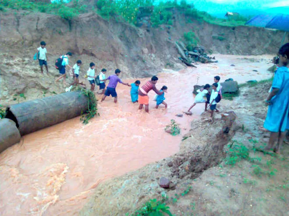  Struggle for education: Students cross watercourse to reach school in Odisha
