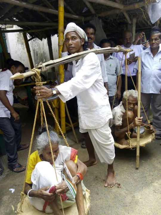  Youth walks 40 km carrying parents in sling in Odisha