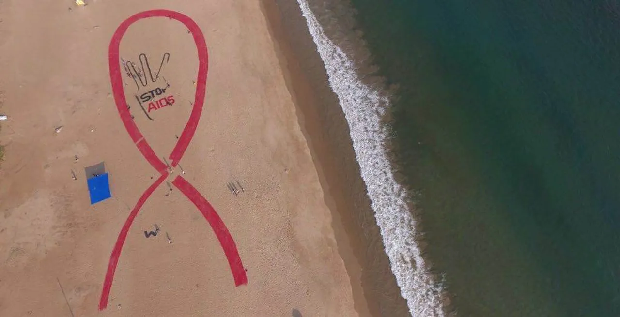  Bird's-eye view of the sand art of universal symbol of awareness for HIV/AIDS on Puri beach in Odisha 