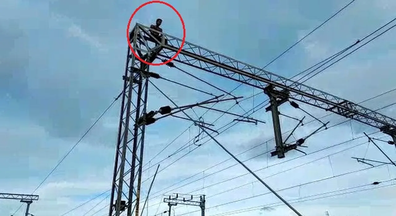  Youth climbs atop electric tower at Odisha's Berhampur railway station