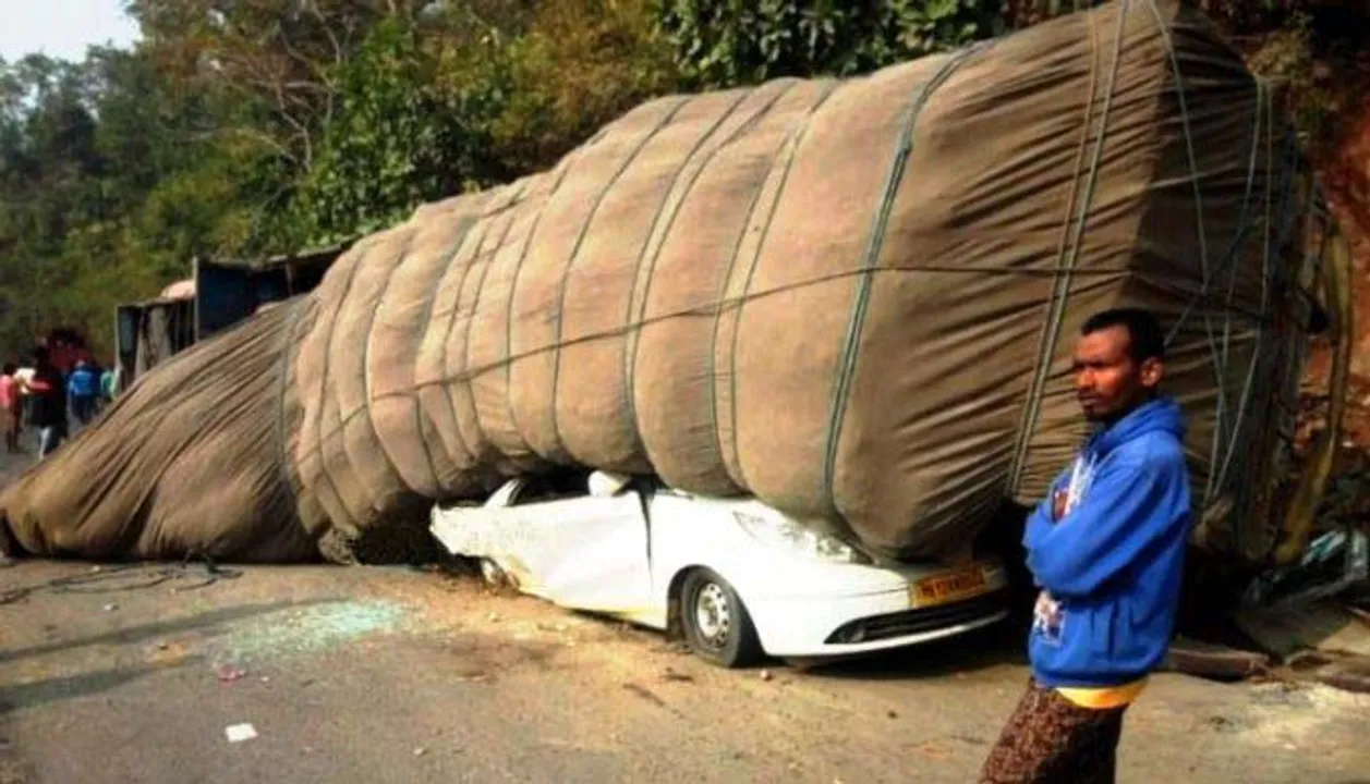  Odisha: Car badly dented after goods-laden truck overturns; See pics