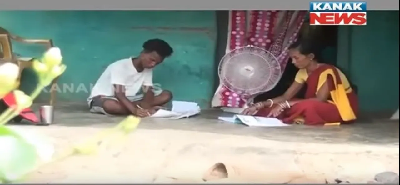  No age bar for learning: Odisha woman clears Matric exam with son