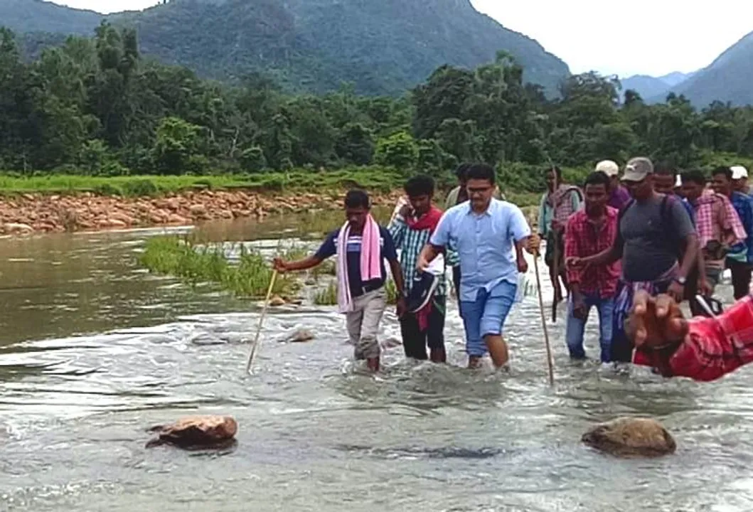  Odisha bureaucrat wades through knee-deep water to reach out to flood victims