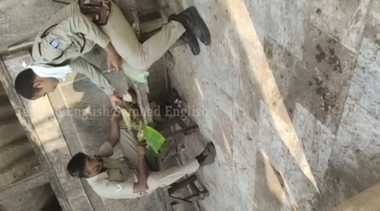  Odisha: Video of cops eating ‘Mahaprasad’ with shoes on goes viral; complaint filed