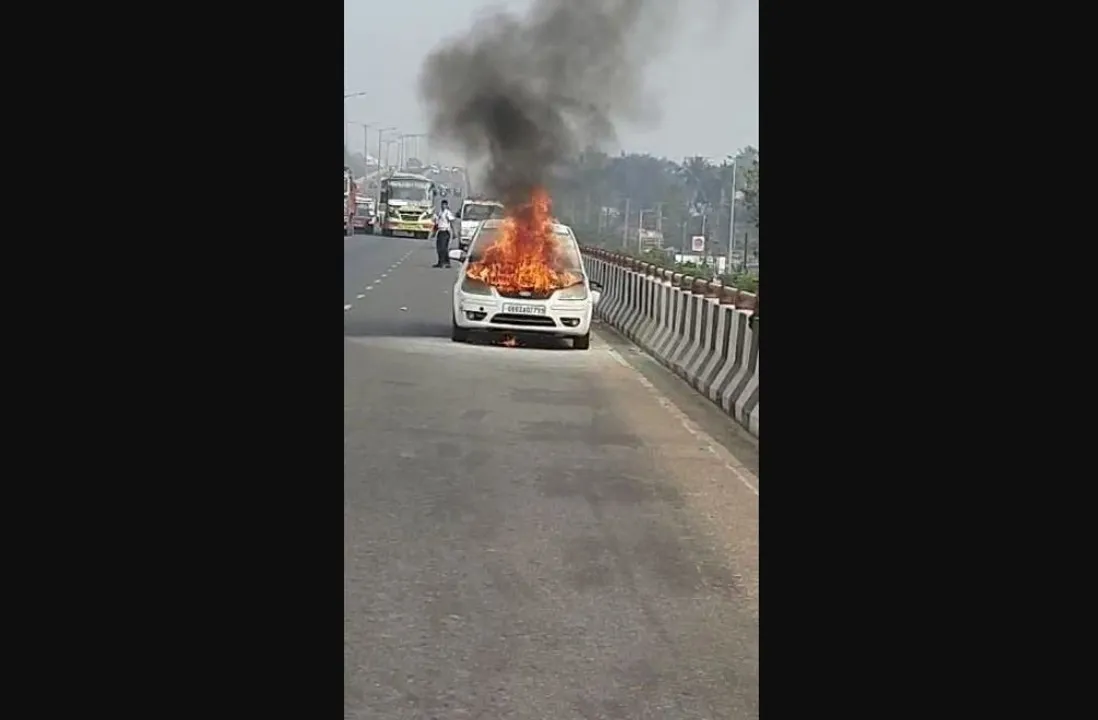  In pics: Car catches fire on flyover in Odisha capital