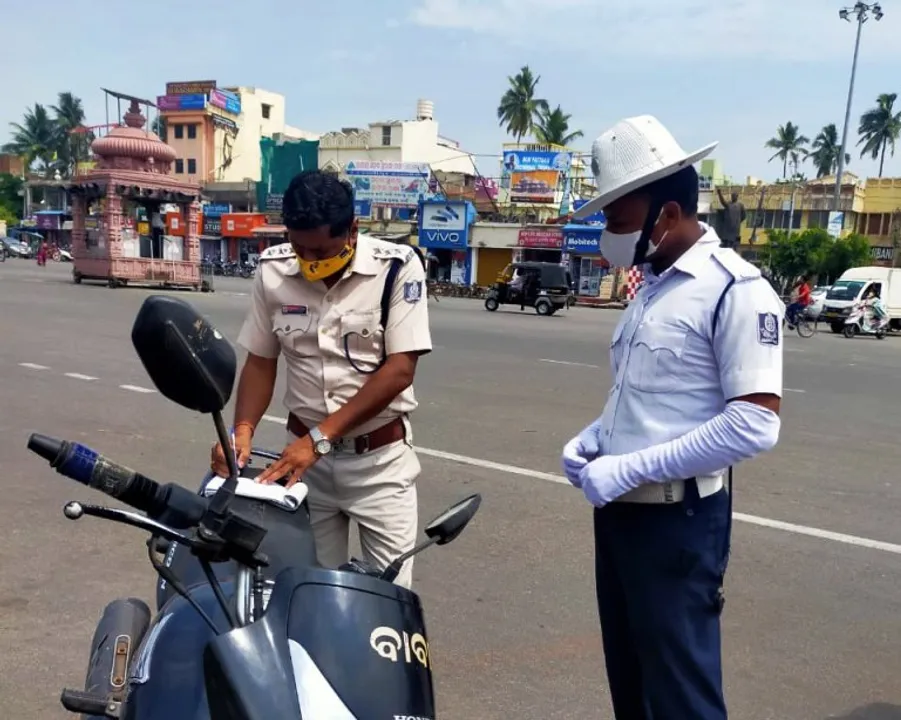  Odisha cop without mask fined Rs 2000
