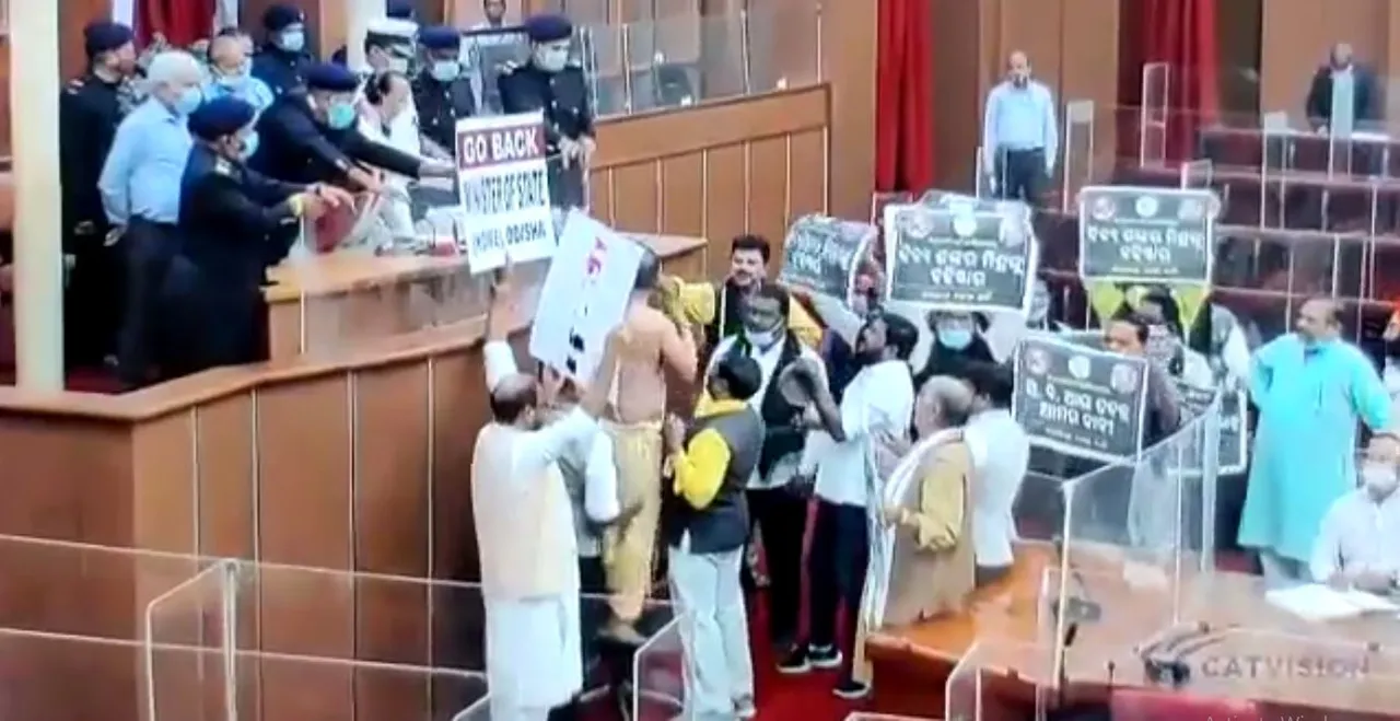  Dressed as priest, MLA sprinkles 'Ganga Jal' in Odisha Assembly