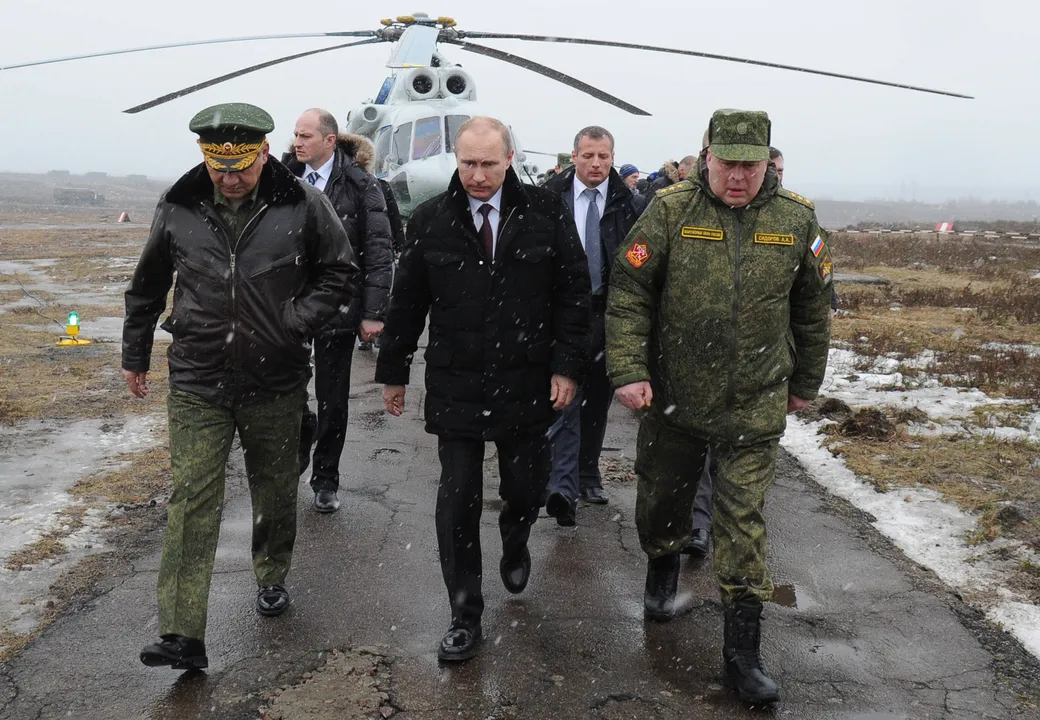  LENINGRAD, RUSSIA - MARCH 3:  Russian Head of State Vladimir Putin orders to Russian army to finish drills in west and center military region in Leningrad, Russia on March 3, 2014. According to datas of Russia Ministry of Defence, in order to examine battle readiness of Russian army, 150 thousands of soldiers, 90 warcrafts, helicopters above 120, 880 tank and 1200 military vehicle join to drill. (Photo by Kremlin Press Information Centre/Anadolu Agency/Getty Images) 