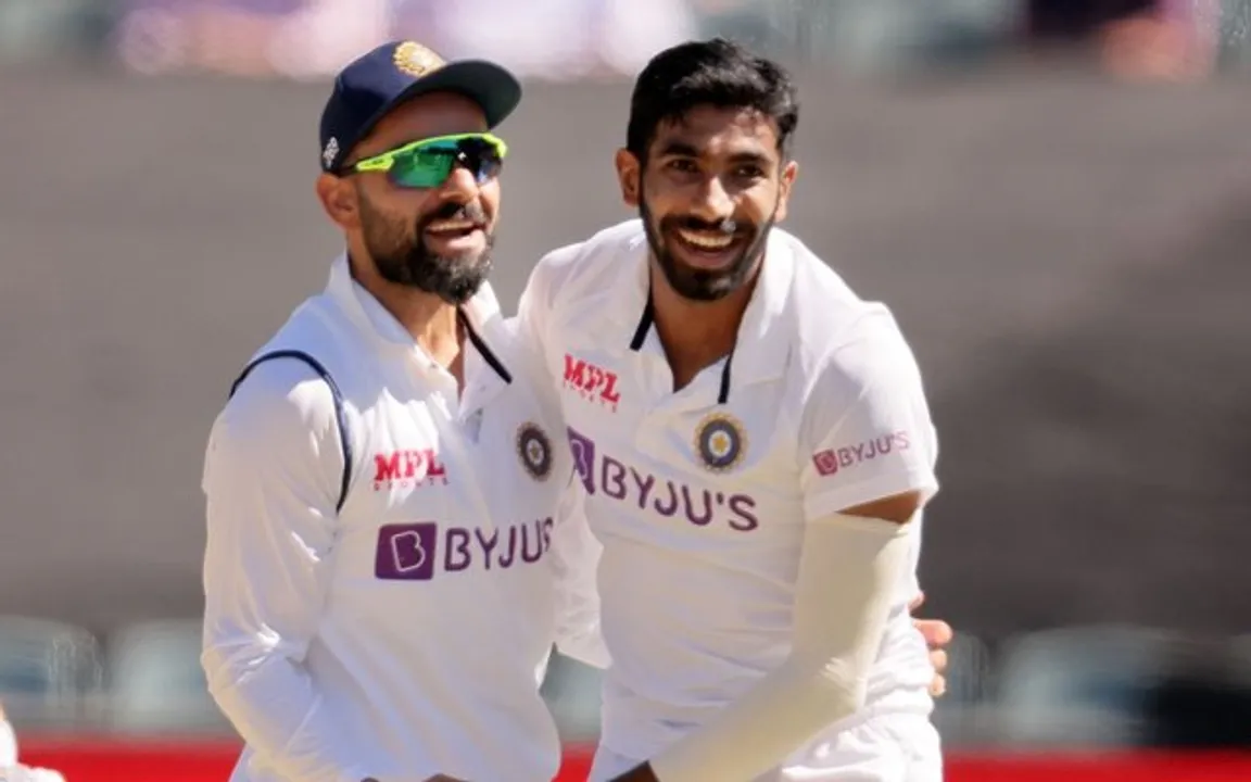  ADELAIDE, AUSTRALIA - DECEMBER 18: Jasprit Bumrah of India and Virat Kohli of India celebrate during day two of the First Test match between Australia and India at Adelaide Oval on December 18, 2020 in Adelaide, Australia. (Photo by Daniel Kalisz - CA/Cricket Australia via Getty Images) 