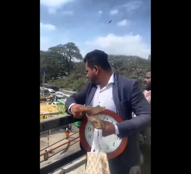  Bengaluru man showers money from Mysuru Road flyover in Kalasipalya [Watch Video]