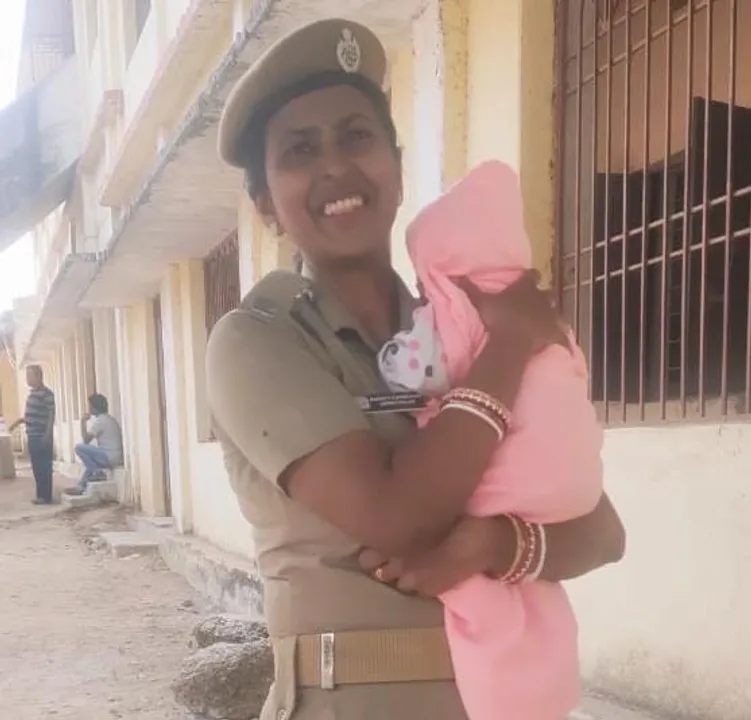  Woman cop babysits, breastfeeds baby while mother appears for exam in Odisha's Malkangiri