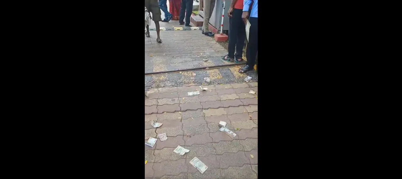  Customers throw currency notes in front of RBI in Bhubaneswar; Here's why