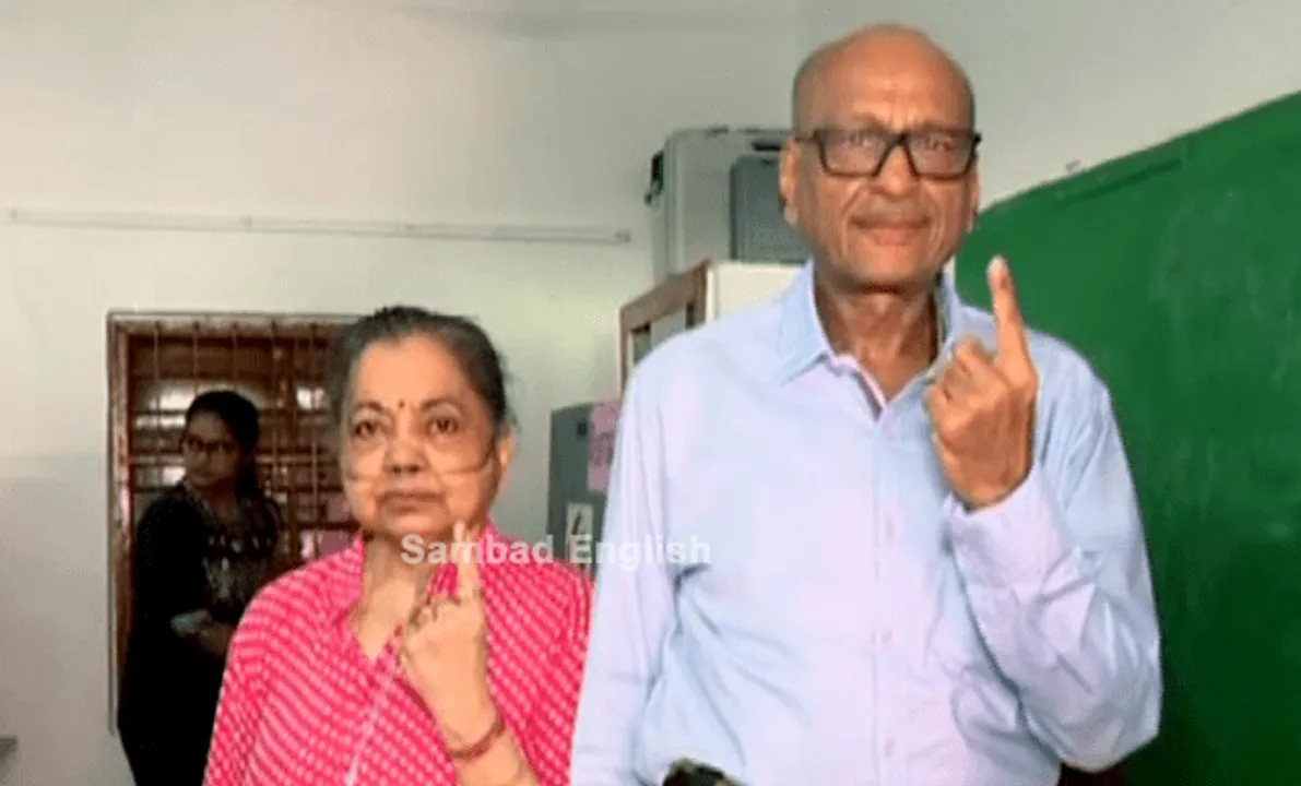  Elderly woman from Odisha on oxygen support visits polling booth to cast votes