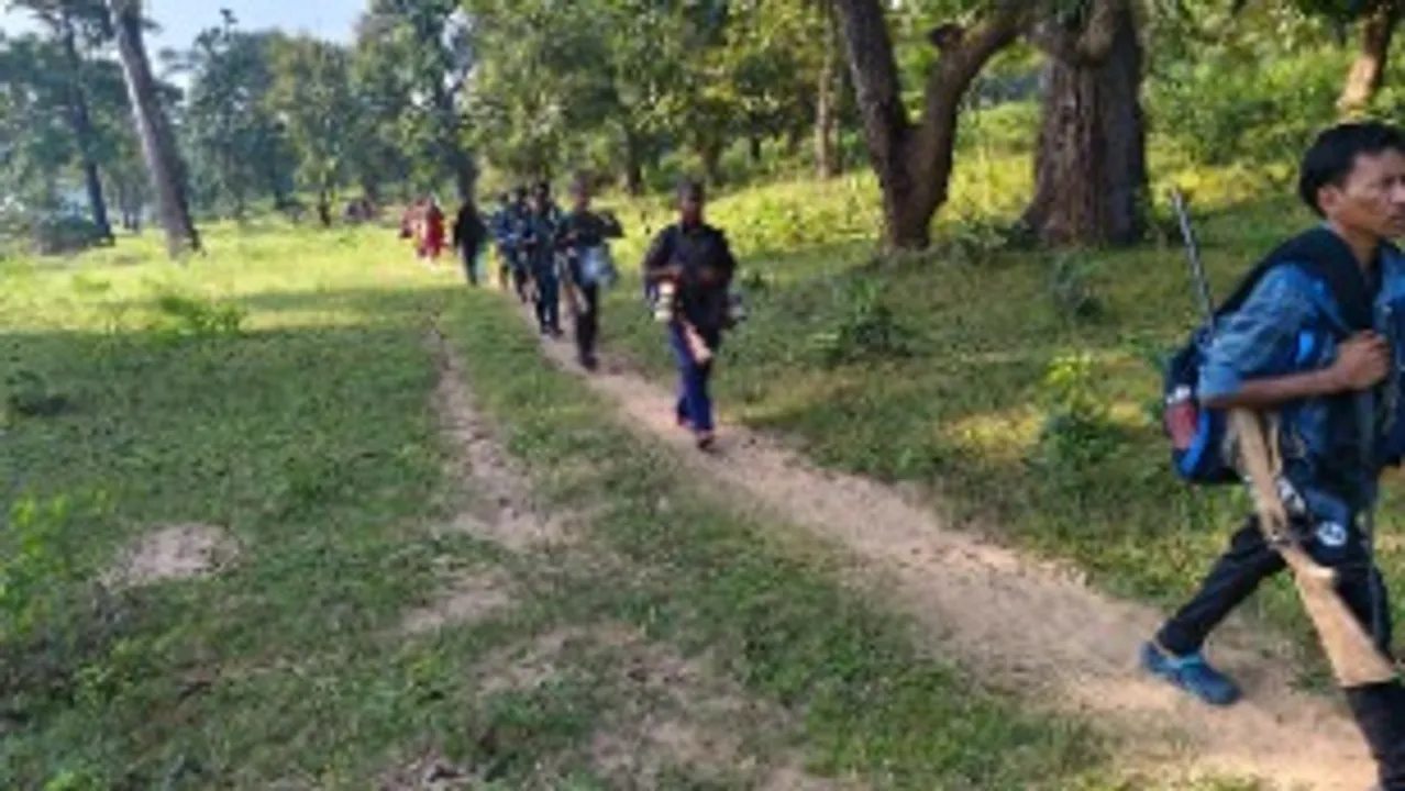  About 150 maoists moving for surrender before Chhattisgarh police. Photograph: (Sambad.in) 