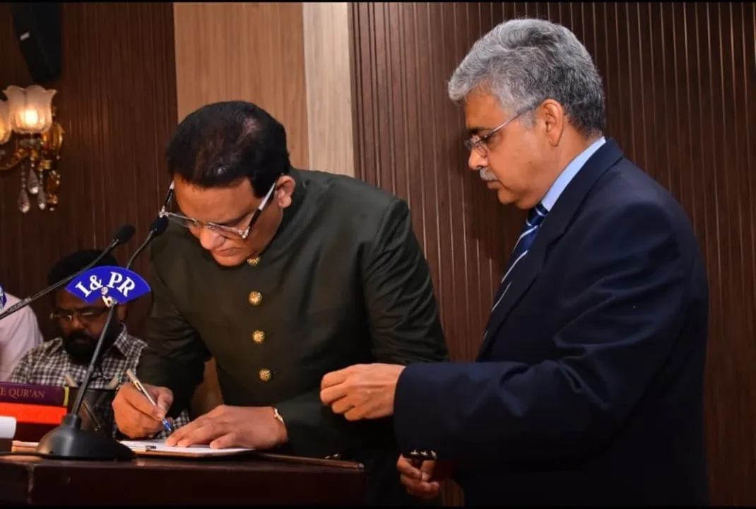  Azharuddin  takes oath as minister 