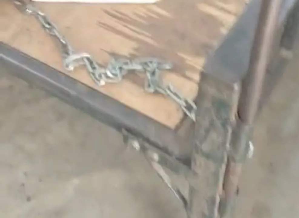  student of class 4 tied with chain at nilagiri Photograph: (Sambad.in) 