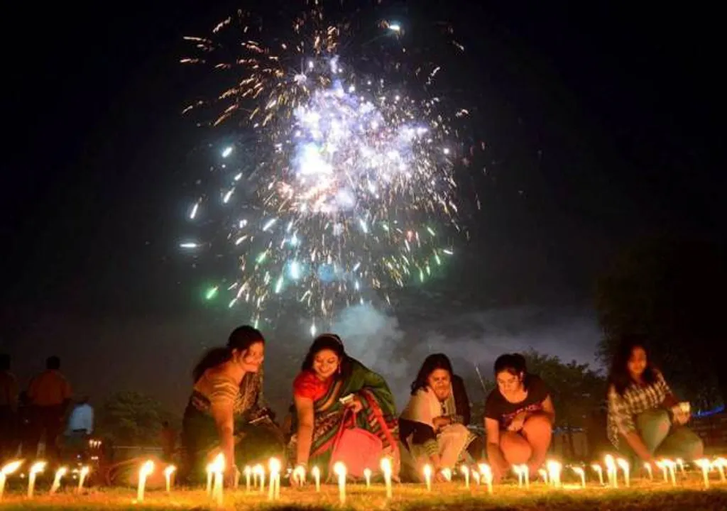  Allahabad: People light candles during track pujan at a stadium on the occasion of Dhanteras Festival Celebration in Allahabad on Friday. PTI Photo (PTI10_29_2016_000032B) 