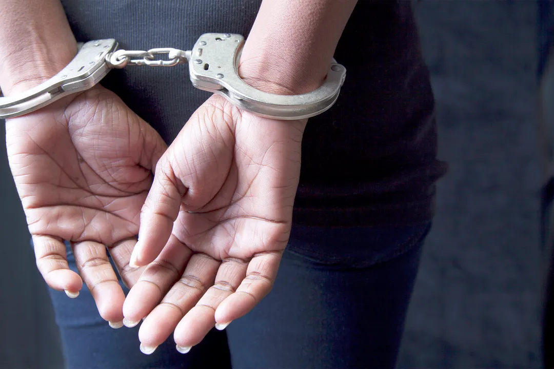  Black woman in handcuffs 