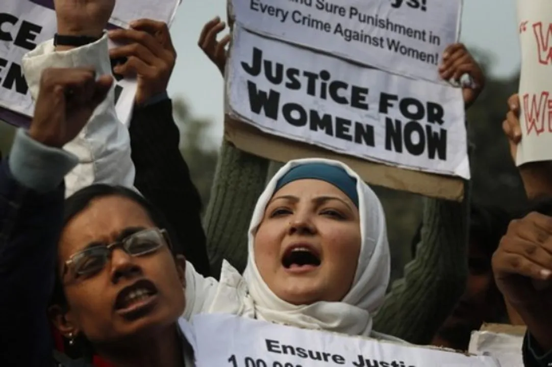  Indian women shout slogans as they  protest against the recent gang-rape of a young woman in a moving bus in New Delhi, India, Thursday, Dec. 27, 2012. Indian Prime Minister Manmohan Singh pledged Thursday to take action to protect the nation's women while the young rape victim was flown to Singapore for treatment of severe internal injuries. (AP Photo/ Saurabh Das) 