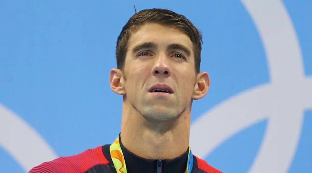 2016 Rio Olympics - Swimming - Victory Ceremony - Men's 4 x 100m Medley Relay Victory Ceremony - Olympic Aquatics Stadium - Rio de Janeiro, Brazil - 13/08/2016. Gold medallist Michael Phelps (USA) of USA stands to attention on the podium.   REUTERS/Dominic Ebenbichler  FOR EDITORIAL USE ONLY. NOT FOR SALE FOR MARKETING OR ADVERTISING CAMPAIGNS. 