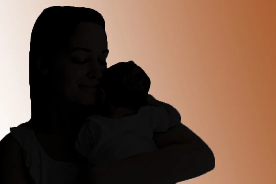  Smiling mother holding baby 