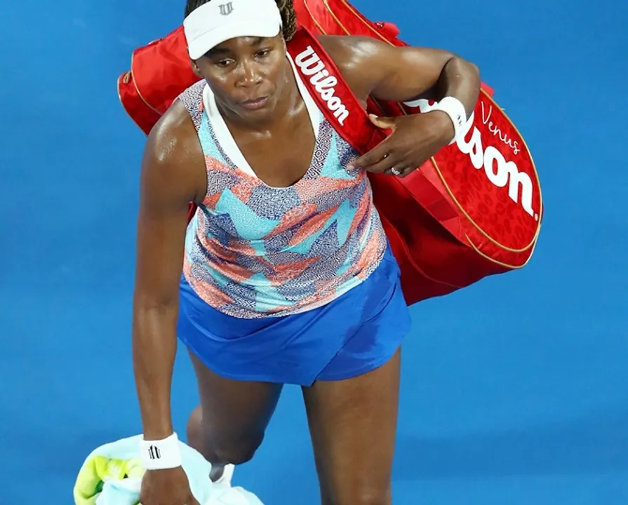  MELBOURNE, AUSTRALIA - JANUARY 15:  A disappointed Venus Williams of the United States walks off the court after losing her first round match against Belinda Bencic of Switzerland on day one of the 2018 Australian Open at Melbourne Park on January 15, 2018 in Melbourne, Australia.  (Photo by Cameron Spencer/Getty Images) 