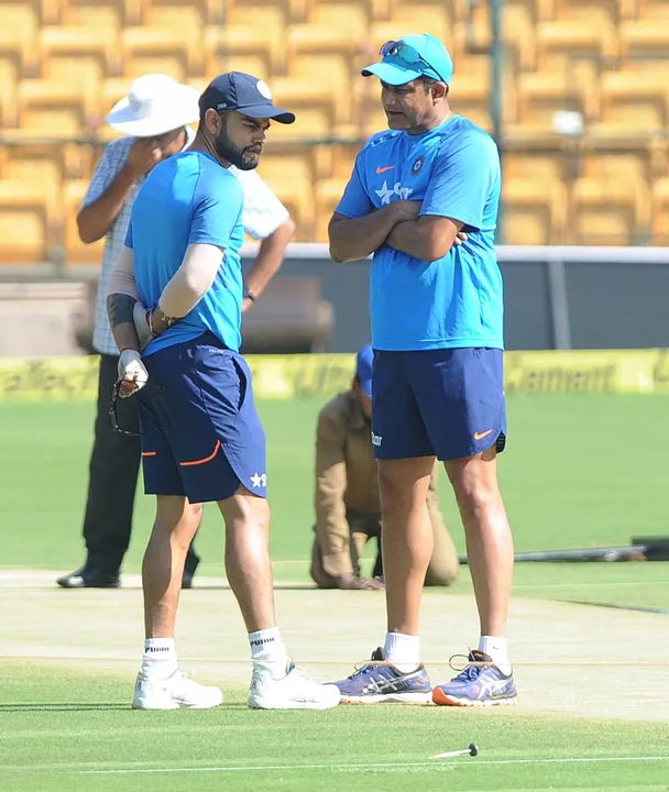  Indian cricket team captain Virat Kohli and Coach Anil Kumble inspecting cricket pitch a day before 2nd Test match to against Australia , at M Chinnaswamy stadium in Bangalore on Friday. 